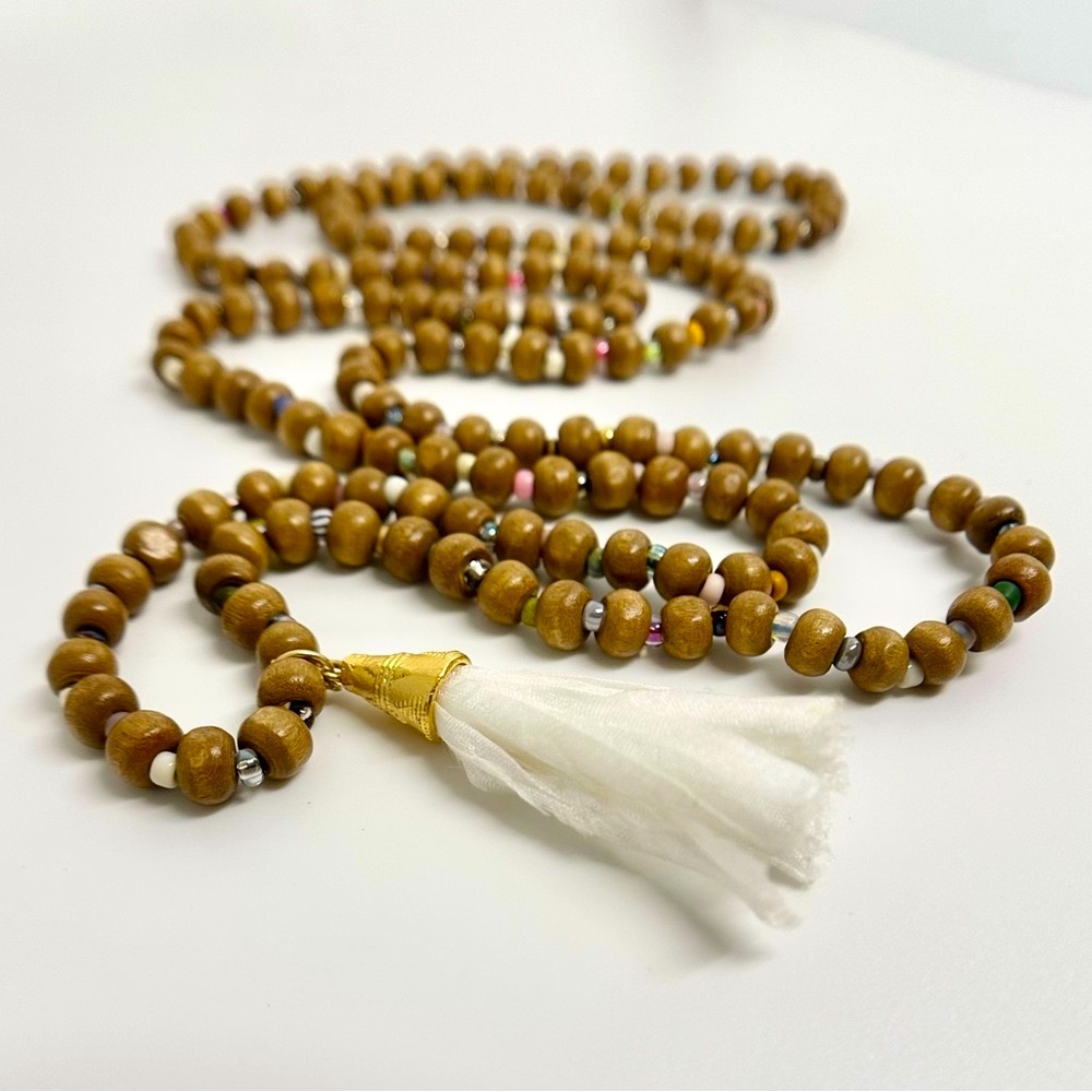 Wood & glass bead mala type necklace w/gold & silk tassel pendant.